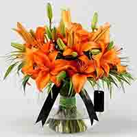 Orange Lilies In Fishbowl Vase
