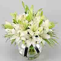 White Asiatic Lilies In Fishbowl Vase